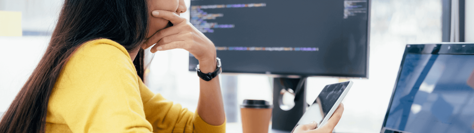 Woman focusing on laptop